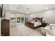 Serene main bedroom with natural light, plush carpet, and sliding glass doors to the patio at 4505 Amazing View St, Las Vegas, NV 89129