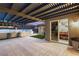 Outdoor patio with a water feature, dining area, and elegant lighting at 4505 Amazing View St, Las Vegas, NV 89129