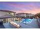 The backyard features a private swimming pool, spa, fire feature, and lounge chairs at 4505 Amazing View St, Las Vegas, NV 89129