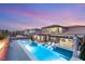 Backyard oasis with a private swimming pool, spa, lounge chairs, and beautifully landscaped surroundings at 4505 Amazing View St, Las Vegas, NV 89129