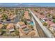 Overhead shot showcases a home with backyard pool, desert landscaping, and neighborhood view at 4548 Switchback St, North Las Vegas, NV 89031