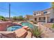 Backyard boasts a custom pool, spa, and patio, perfect for relaxation and entertainment at 4548 Switchback St, North Las Vegas, NV 89031