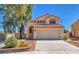 Charming home featuring a symmetrical facade, tile roof, and two-car garage at 4548 Switchback St, North Las Vegas, NV 89031