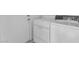 Efficient laundry room with white washer and dryer units, along with access to the exterior at 4548 Switchback St, North Las Vegas, NV 89031