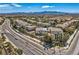 A distant aerial shot of a stucco home with solar panels in a suburban community at 4804 Laurentia Ave, Las Vegas, NV 89141
