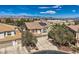 An aerial view of a house with solar panels and a tile roof in a suburban neighborhood at 4804 Laurentia Ave, Las Vegas, NV 89141