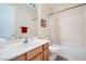 Clean bathroom with a single vanity, tub-shower combo, and white tile surround at 4804 Laurentia Ave, Las Vegas, NV 89141