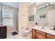 Bathroom featuring a walk-in shower, wood vanity, and modern fixtures at 4804 Laurentia Ave, Las Vegas, NV 89141