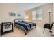 Neutral bedroom with carpet, simple furnishings, and bright window at 4804 Laurentia Ave, Las Vegas, NV 89141