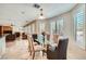 Bright dining room with glass table, neutral chairs, and plantation shutters at 4804 Laurentia Ave, Las Vegas, NV 89141