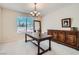 Dining room featuring a wooden table and buffet, lit by a chandelier at 4804 Laurentia Ave, Las Vegas, NV 89141