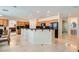 Expansive kitchen with a large island, tile flooring, and a breakfast bar at 4804 Laurentia Ave, Las Vegas, NV 89141