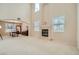 Spacious living room featuring a fireplace and tall windows at 4804 Laurentia Ave, Las Vegas, NV 89141