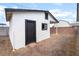 External of home showing side entry door and textured stucco walls at 50 Armstrong Cir, Henderson, NV 89015
