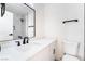 Bright bathroom with white vanity, modern black fixtures, and a large mirror at 50 Armstrong Cir, Henderson, NV 89015