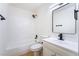 Clean, well-lit bathroom featuring white tile, modern fixtures, and a spacious vanity at 50 Armstrong Cir, Henderson, NV 89015