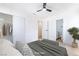 Bedroom with walk-in closet and view to bathroom, featuring neutral decor at 50 Armstrong Cir, Henderson, NV 89015
