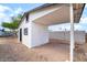 Exterior of home showing textured walls and a detached carport structure at 50 Armstrong Cir, Henderson, NV 89015