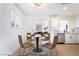 Cozy dining area featuring modern light fixture and an open layout with kitchen access at 50 Armstrong Cir, Henderson, NV 89015