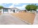 Charming single-story home with a well-maintained gravel yard and modern white and black trim at 50 Armstrong Cir, Henderson, NV 89015