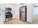 Modern kitchen featuring stainless steel appliances and ample white cabinet space at 50 Armstrong Cir, Henderson, NV 89015
