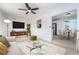 Open living room showcasing modern furniture, wood accents, and seamless flow into the dining and kitchen areas at 50 Armstrong Cir, Henderson, NV 89015
