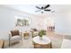 Bright living room with neutral tones, a ceiling fan, and an open floor plan at 50 Armstrong Cir, Henderson, NV 89015