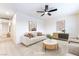 Airy living room featuring modern decor, ceiling fan, and sleek hardwood floors at 50 Armstrong Cir, Henderson, NV 89015