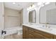 Stylish bathroom featuring double vanity, tub, shower, modern fixtures, and excellent lighting at 5000 Linkside Dr, Las Vegas, NV 89130