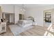 Bright, airy bedroom with wood floors, neutral color scheme, and access to a private patio at 5000 Linkside Dr, Las Vegas, NV 89130