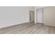 Empty bedroom featuring wood-look floors and a closet with sliding doors at 5000 Linkside Dr, Las Vegas, NV 89130