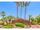 Los Prados Golf Community & Country Club entrance with palm trees and lush landscaping at 5000 Linkside Dr, Las Vegas, NV 89130