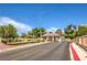 Welcoming community entrance with well-manicured landscaping and a secure gatehouse at 5000 Linkside Dr, Las Vegas, NV 89130