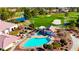 Aerial view of a sparkling community pool, spa, and lush landscaping within a golf course community at 5000 Linkside Dr, Las Vegas, NV 89130