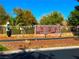 Community signage surrounded by beautiful landscaping and well-maintained greenery for Villages of Los Prados at 5000 Linkside Dr, Las Vegas, NV 89130