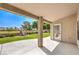 Covered patio with concrete flooring offering serene views of the green backyard and golf course at 5000 Linkside Dr, Las Vegas, NV 89130