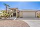 Inviting front of a single-story house with desert landscaping and a two-car garage at 5000 Linkside Dr, Las Vegas, NV 89130