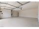 Spacious two-car garage featuring a clean epoxy floor and ample storage space at 5000 Linkside Dr, Las Vegas, NV 89130