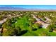 Expansive aerial view showcasing the golf course community with mountain backdrop at 5000 Linkside Dr, Las Vegas, NV 89130