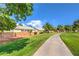 Beautiful golf course view with mature trees, lush greenery, and a manicured walking path at 5000 Linkside Dr, Las Vegas, NV 89130
