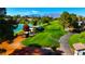 Scenic view of the lush golf course with a tranquil pond and mountain views in the background at 5000 Linkside Dr, Las Vegas, NV 89130