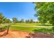 Scenic golf course view with mature trees and lush green landscaping at 5000 Linkside Dr, Las Vegas, NV 89130