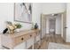 Hallway with wood-look floors, neutral paint, and decorative furniture at 5000 Linkside Dr, Las Vegas, NV 89130