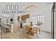 Bright open kitchen with pendant lighting, stainless appliances, an island with bar seating, and wood floors at 5000 Linkside Dr, Las Vegas, NV 89130