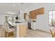 Bright open kitchen with stainless appliances, an island with bar seating, and white countertops at 5000 Linkside Dr, Las Vegas, NV 89130