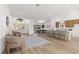 Bright open concept living area with wood flooring, recessed lights, neutral paint, and modern decor at 5000 Linkside Dr, Las Vegas, NV 89130