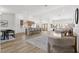 Spacious open concept living area with wood flooring, recessed lights, neutral paint, and modern decor at 5000 Linkside Dr, Las Vegas, NV 89130