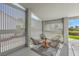Charming patio space featuring stylish modern seating, lattice enclosure and access to the beautiful outdoors at 5000 Linkside Dr, Las Vegas, NV 89130