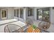 Beautiful patio setting with modern seating and a sliding glass door to seamlessly integrate indoor-outdoor living at 5000 Linkside Dr, Las Vegas, NV 89130