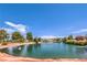 Scenic community pond with lush landscaping, mature trees, and a tranquil water feature at 5000 Linkside Dr, Las Vegas, NV 89130